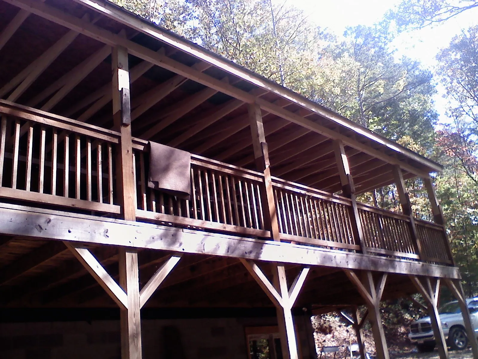 Timber framing under a new elevated porch and deck — Roof Leak Repair in Masury by Roofing Brothers